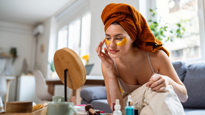 Woman applying skincare