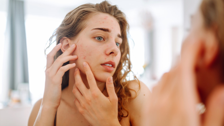 Woman applying skincare