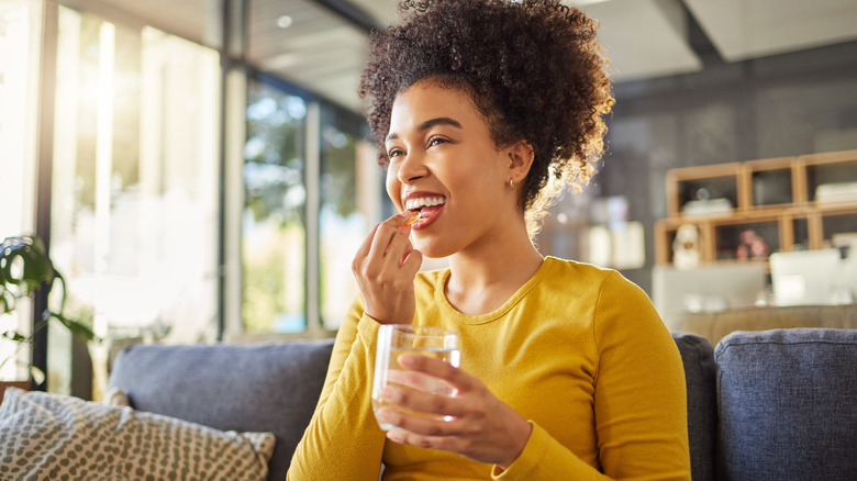 Woman taking supplements