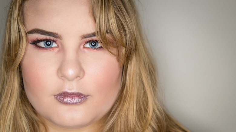 Woman modeling tomato girl makeup