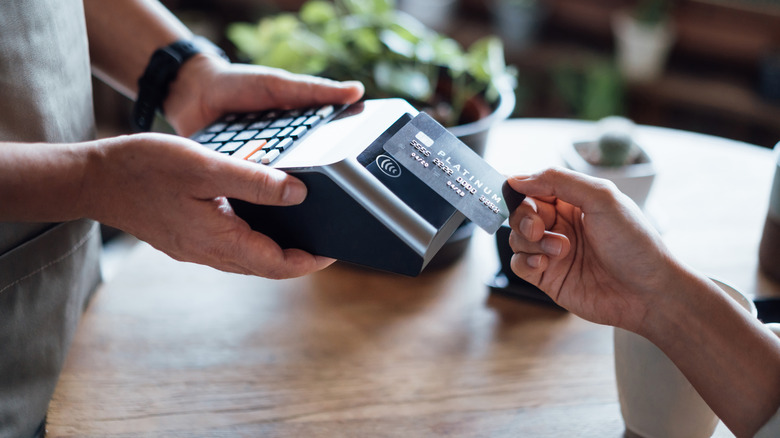 Person using credit card