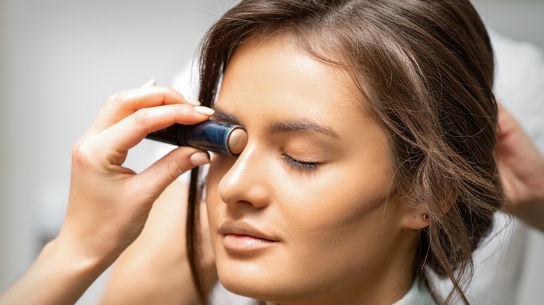 Woman highlighting on nose