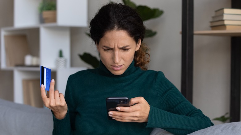 Woman holding credit card