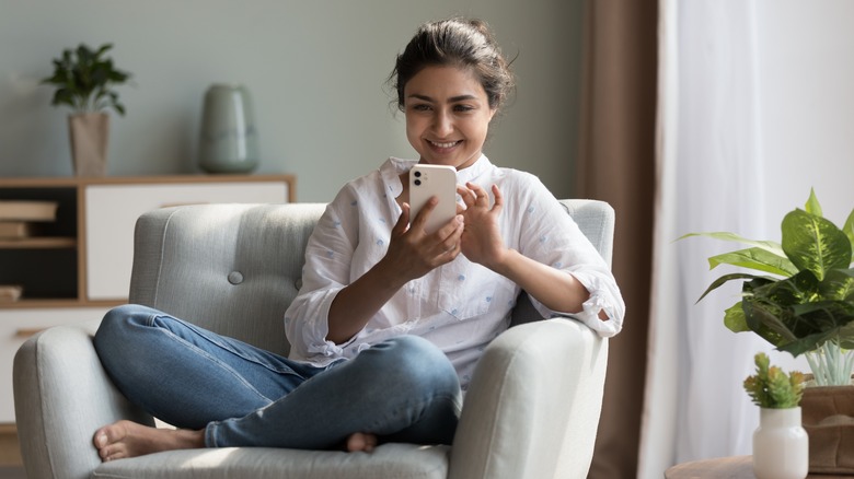 Woman scrolling social media