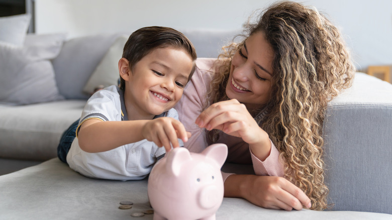 Mother and son saving money