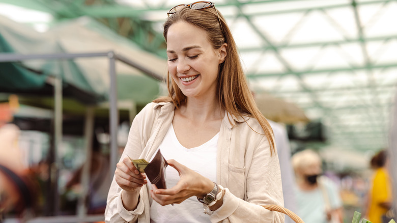 Woman paying with cash