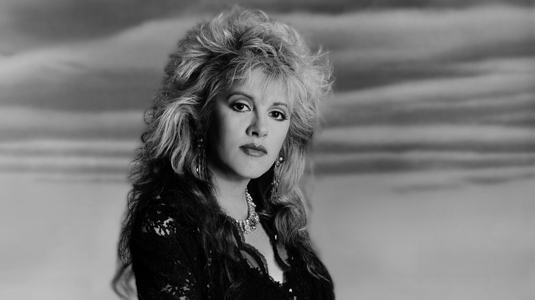A black-and-white photo of Stevie Nicks with big hair