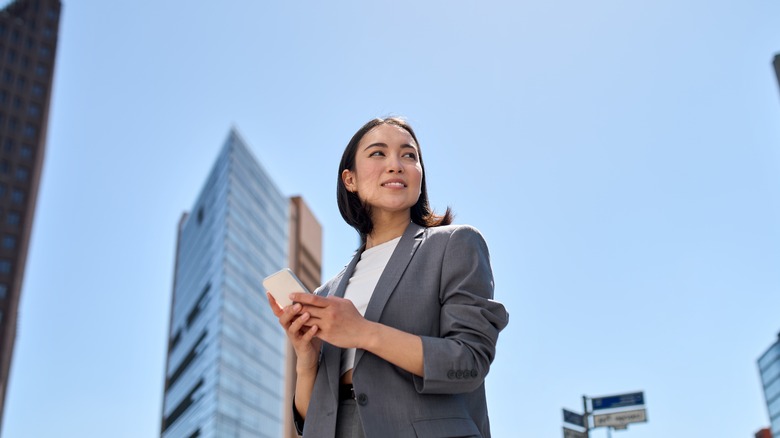 Business casual woman on her phone