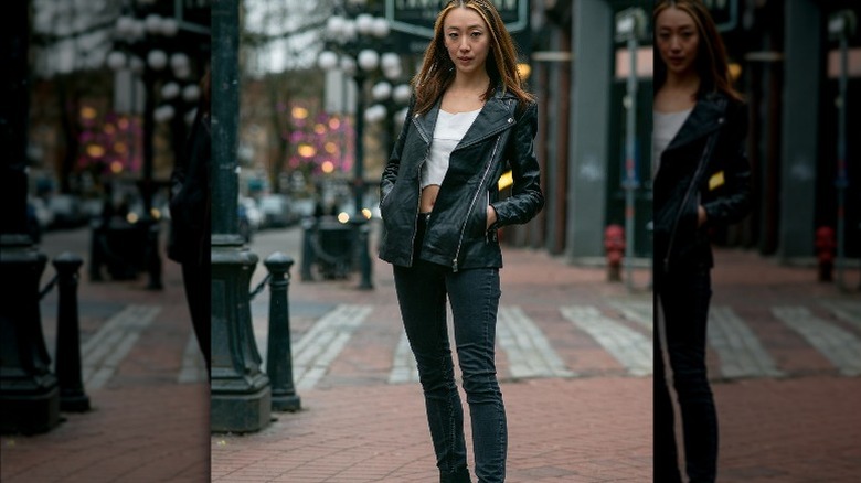Woman wearing leather moto jacket 