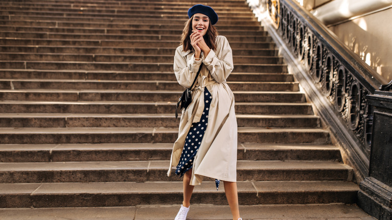 Woman in trench coat and beret