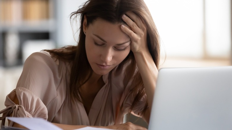 Woman tired looking at tasks