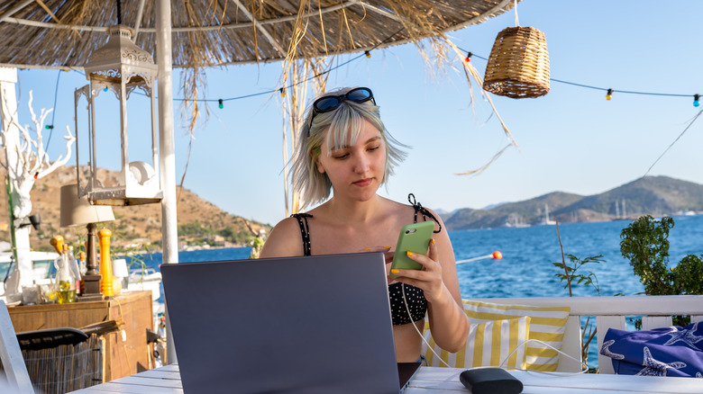 Woman working while on vacation