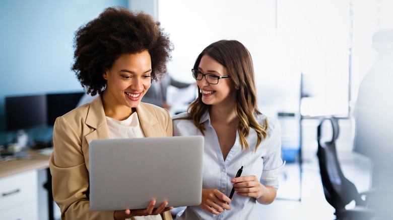 Women working and smiling together