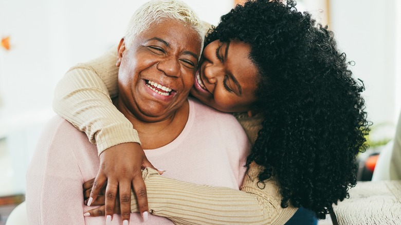 daughter embracing mother
