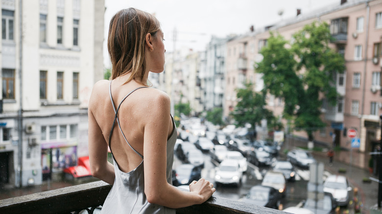 White woman wearing backless dress