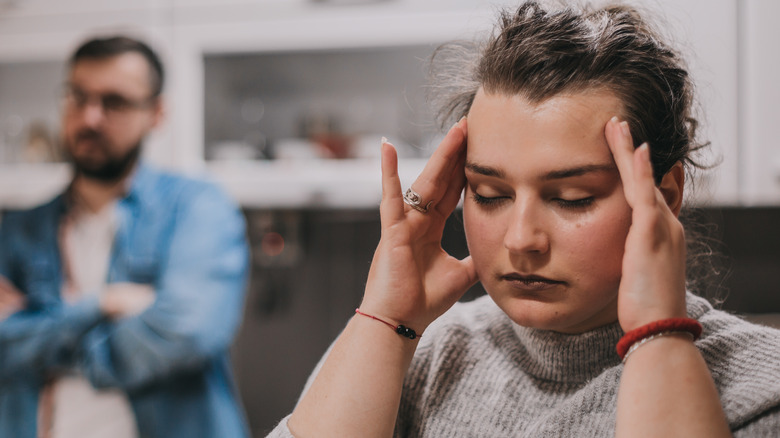 woman stressed by male partner