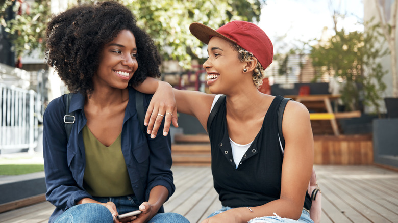 Queer couple smiling