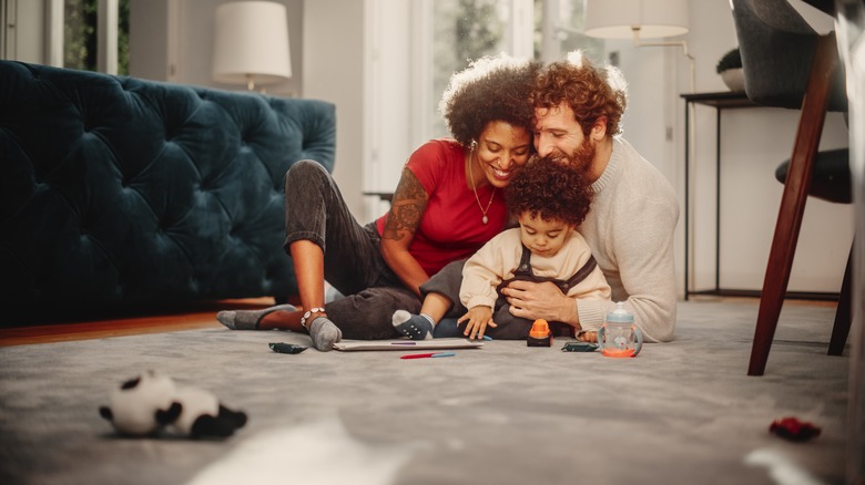 parents and child playing together
