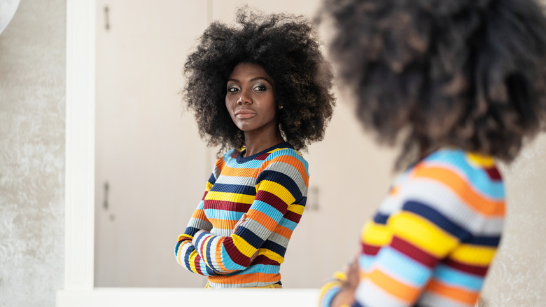 Woman looking in the mirror