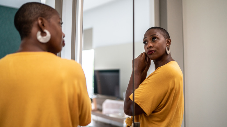 Woman wearing large hoop earrings