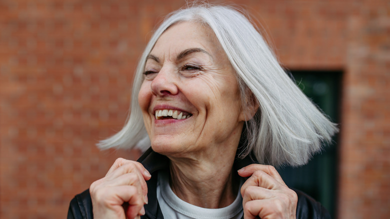 Older woman with gray hair smiling