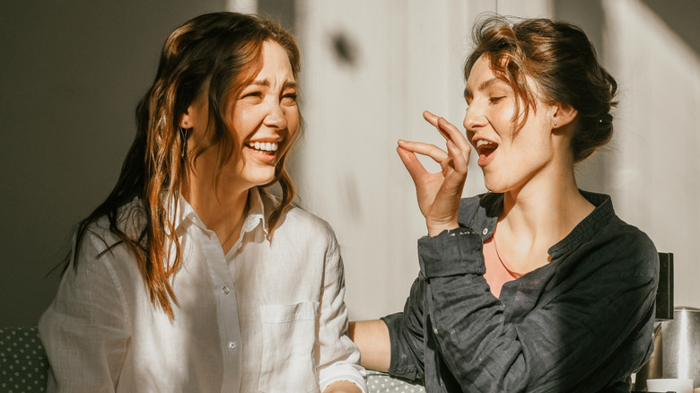 Two women chatting and smiling