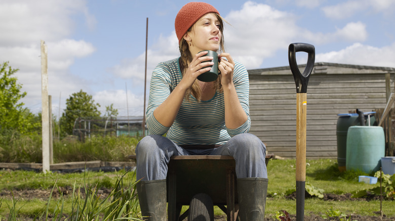 Woman sitting in garden