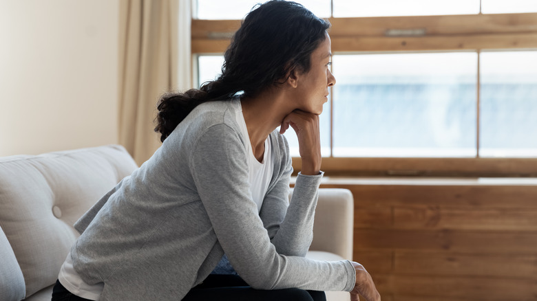 woman looking out the window