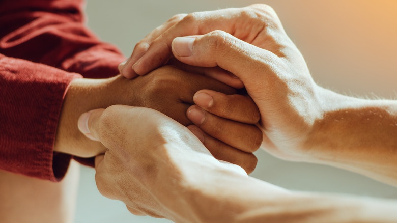 hand holding up close