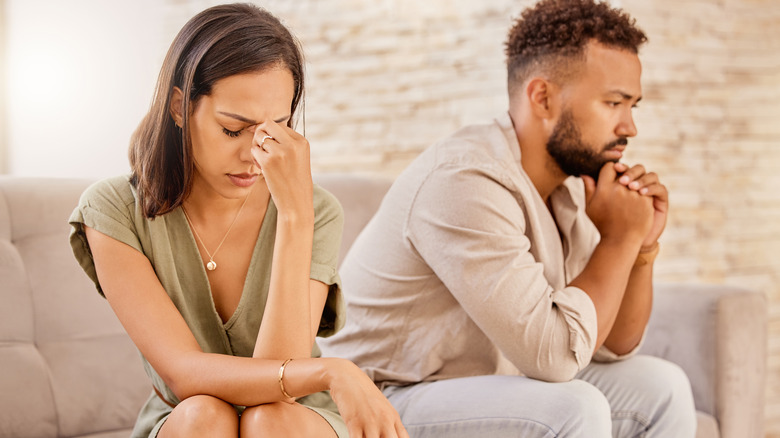 couple on couch arguing