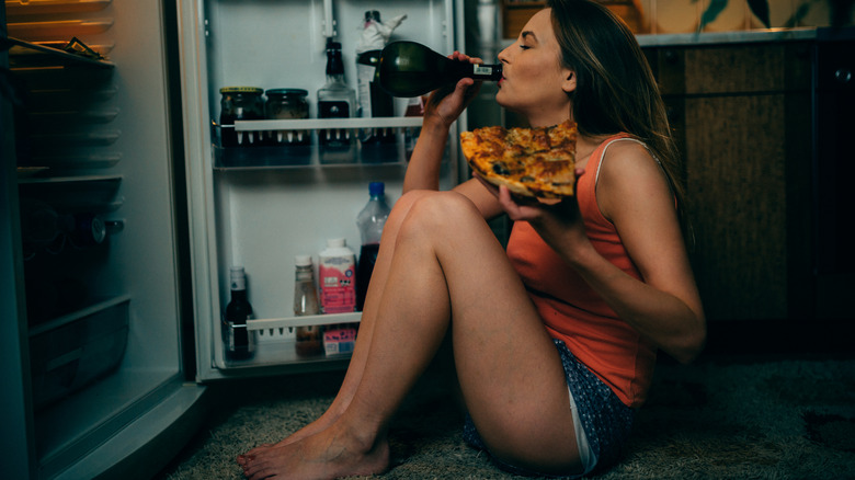 woman drinking and eating
