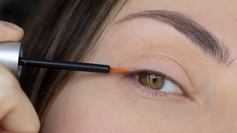 Applying lash serum