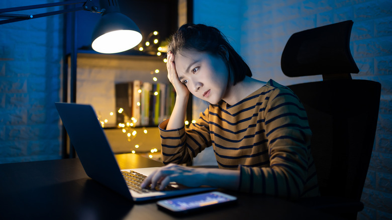 Person looking at laptop