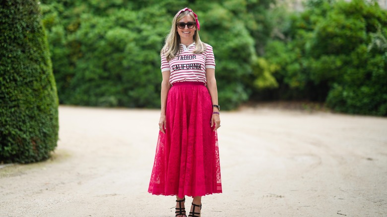 Woman with orange volumnious skirt