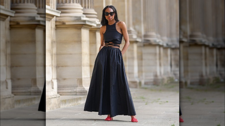 Woman in black full volume skirt