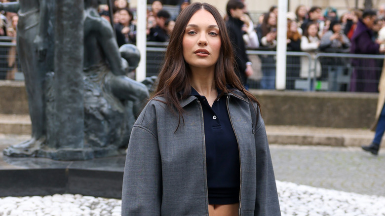 Maddie Ziegler posing outdoors for a fashion event