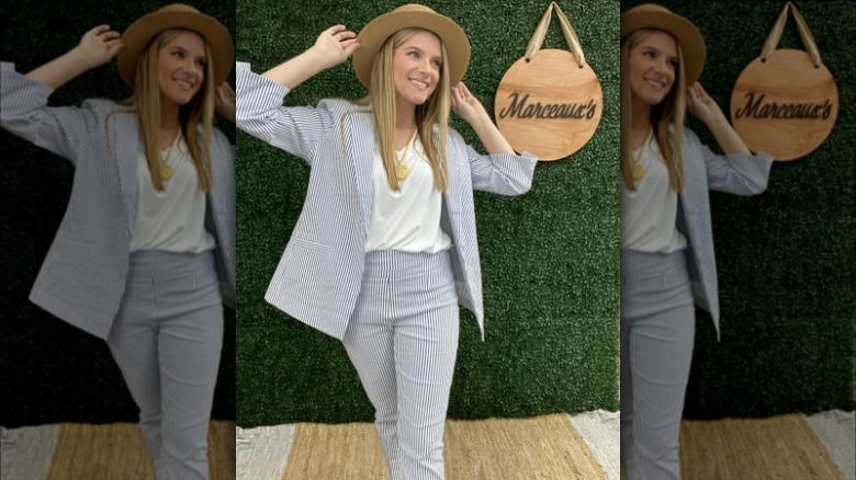 Woman in suit and hat