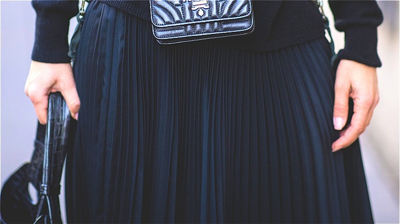 details of black micro pleat skirt