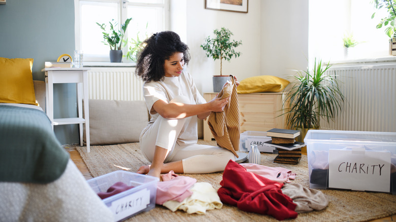 woman sorting through clothes