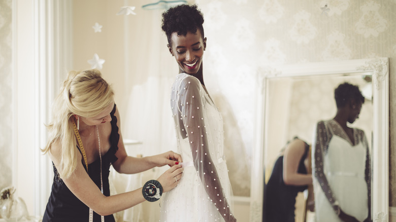 Bride getting a fitting