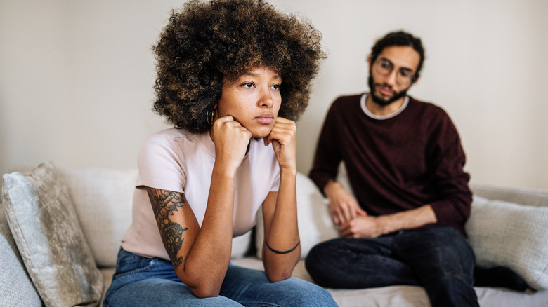 couple arguing on couch