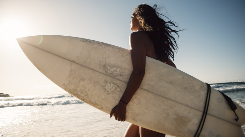 female surfer on beach