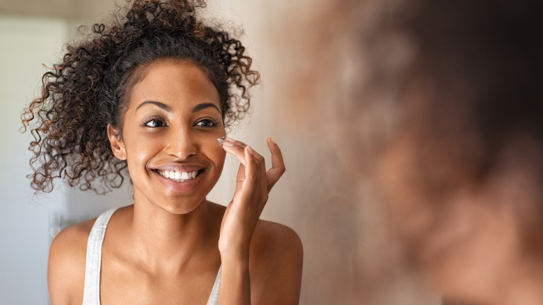 Applying face cream