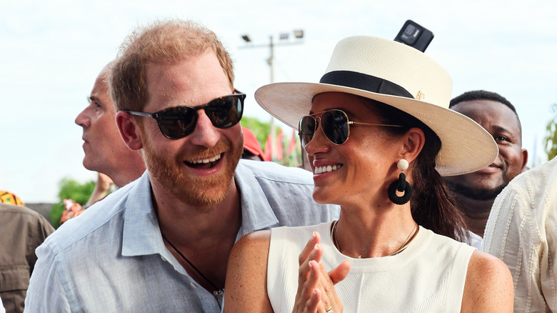 Meghan Markle in a hat and Prince Harry in Colombia