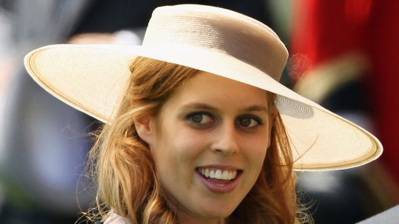 Princess Beatrice at the Royal Ascot wearing a straw hat