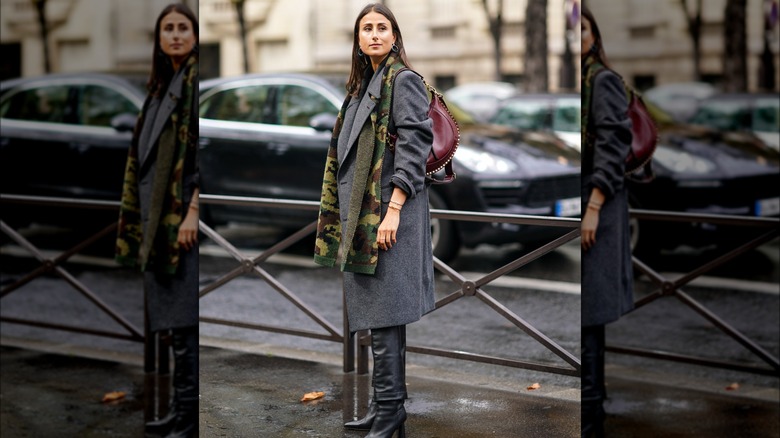 A woman wearing camo 
