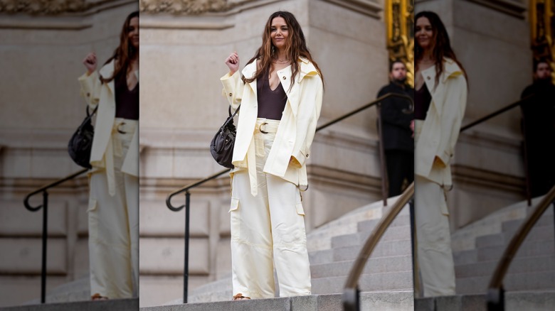 Katie Holmes in a butter yellow pant suit with a brown top in Paris