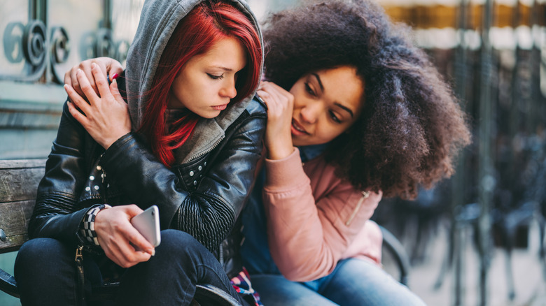Woman comforting her friend
