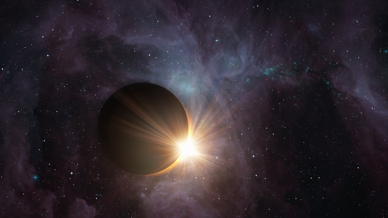 Solar eclipse with Orion's Belt in the background