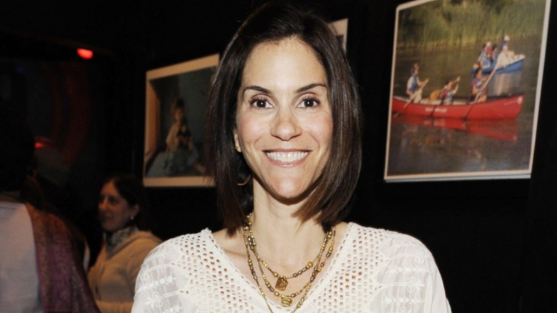 Jami Gertz smiling with a blunt bob at an event in 2010